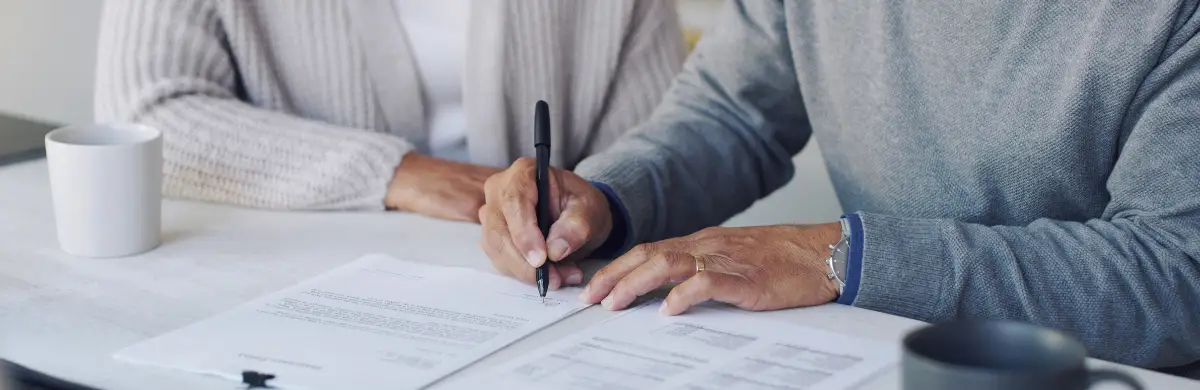 couple signing paperwork